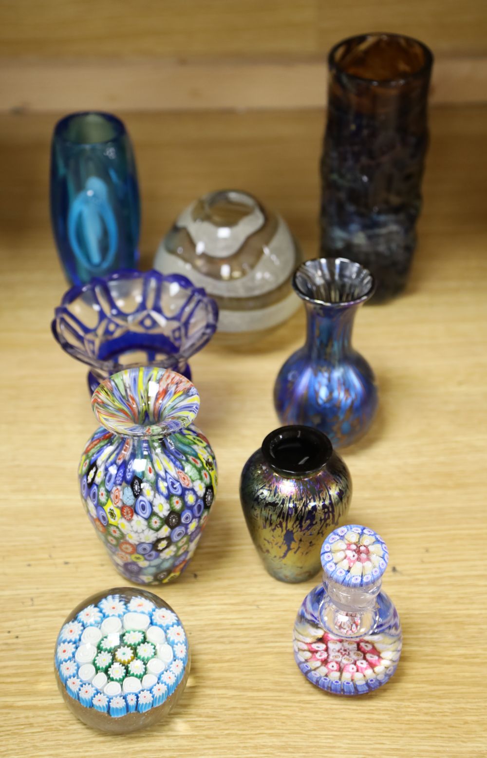 A millefiori weight, a scent bottle with stopper, a jar and six other coloured glass items